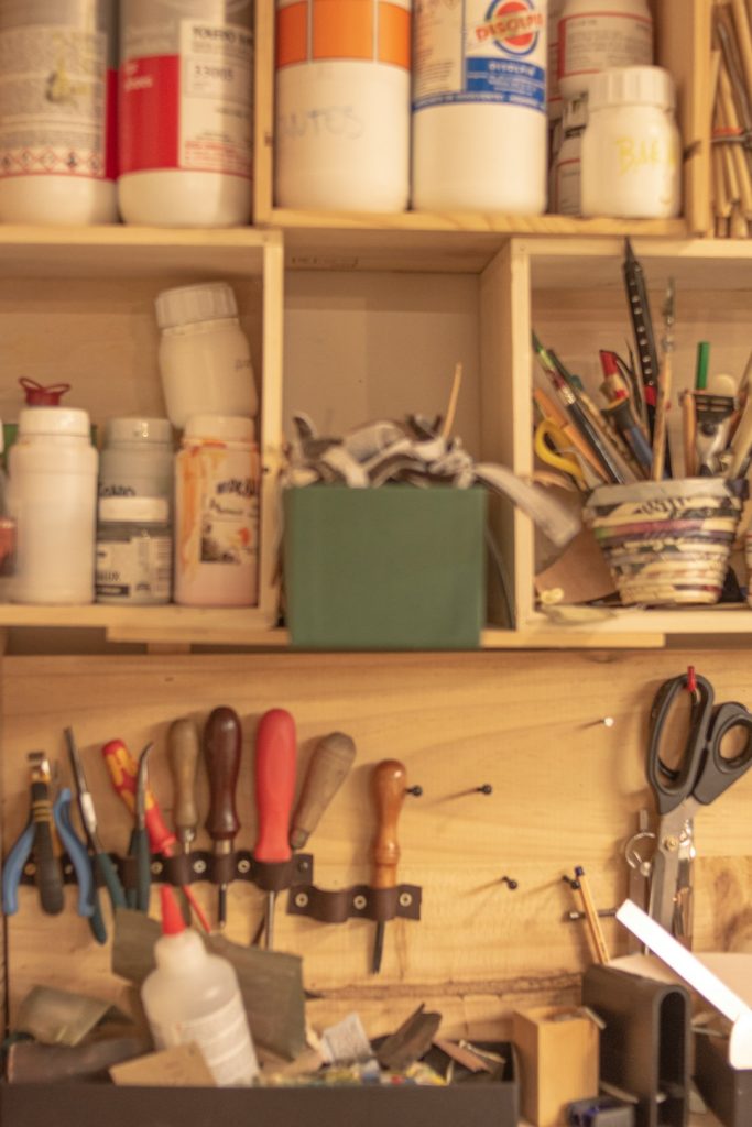a-wooden-shelf-filled-with-lots-of-craft-supplies-yvnns-se2fw